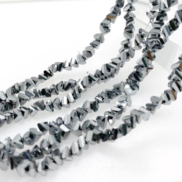 Намистини Swarovski ограновування трикутник 3 мм 27 см (+-130 шт.) Сріблястий металік