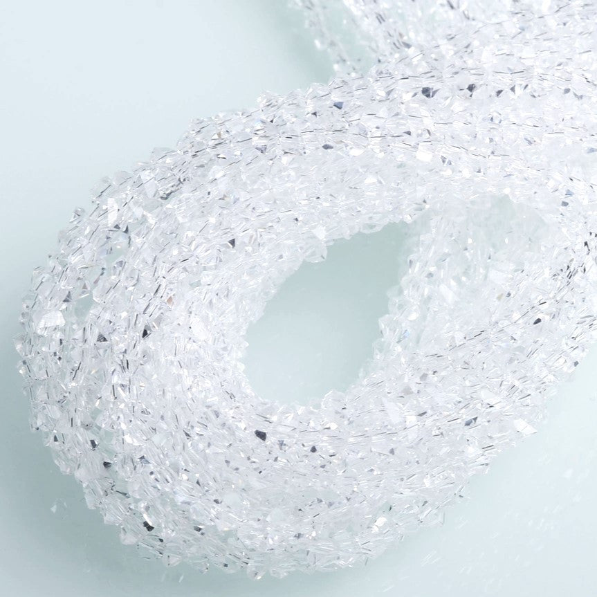 Намистини Swarovski ограновування трикутник 2 мм 22 см (+-148 шт.) Прозорий