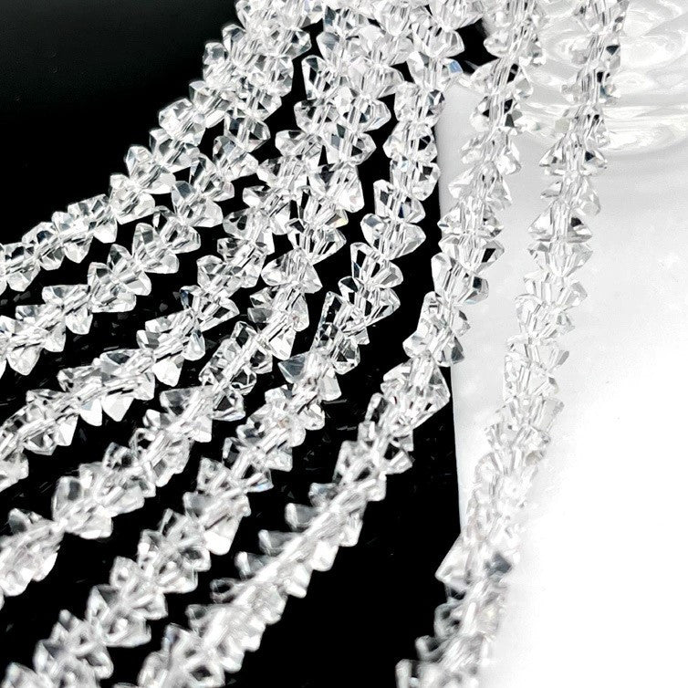 Намистини Swarovski ограновування трикутник 3 мм 27 см (+-130 шт.) Прозорий